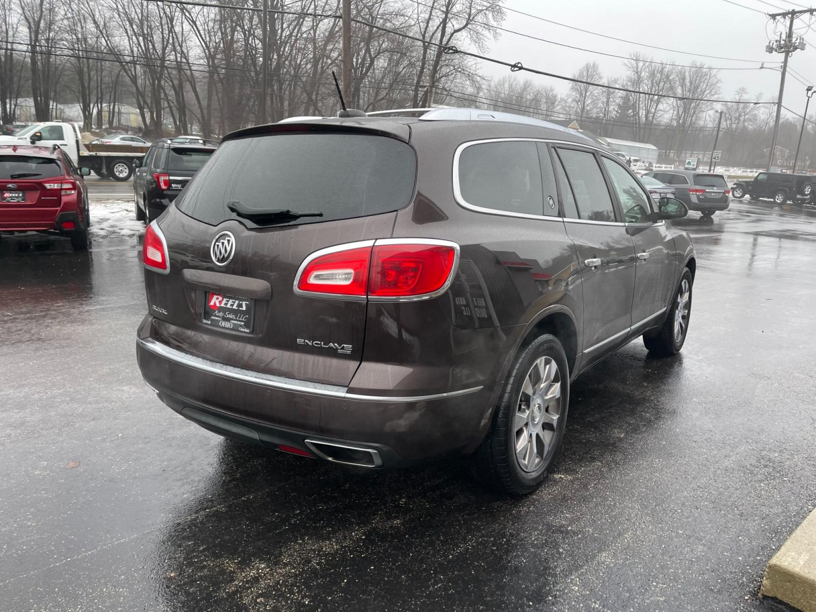 2016 Brown /Brown Buick Enclave Premium AWD (5GAKVCKD4GJ) with an 3.6L V6 DOHC 24V engine, 6A transmission, located at 547 E. Main St., Orwell, OH, 44076, (440) 437-5893, 41.535435, -80.847855 - This 2016 Buick Enclave Premium AWD boasts a luxurious range of features including single-owner status, climate-controlled leather seats, adaptive HID headlights for improved visibility, and safety features like blind spot monitoring and rear cross-traffic alert. Its towing capability is notable at - Photo #7